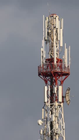 Aerial view of the top of telecommunication tower. Its antennas designed for transmitting cellular mobile signals covering large areas providing high speed 4g and modern 5g traffic network service.