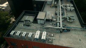 Drone view of industrial HVAC units and piping on a rooftop in a commercial building taken. Engineering systems installed - Powered by Shutterstock - Get 15% off with code: PIKWIZARD15