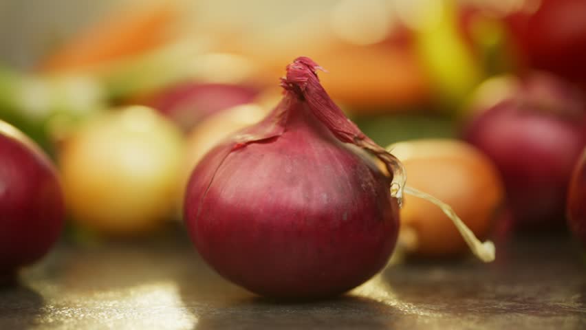 Smaller ordinary bulbs roll up to the big purple bulb on the table. High quality FullHD footage