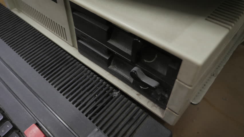 The Inserting Old-style 5.25 Inch Floppy Disk. Old Pc Look