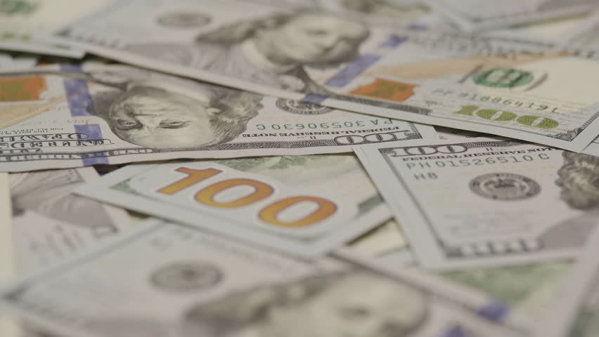 Close-Up of Scattered US 100 Dollar Bills