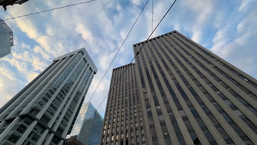 A Captivating Look At The Tall Skyscrapers In Downtown Toronto, The Bright Sun Illuminating The Modern Office Buildings That Shape The City Business District. Ontario, Canada.