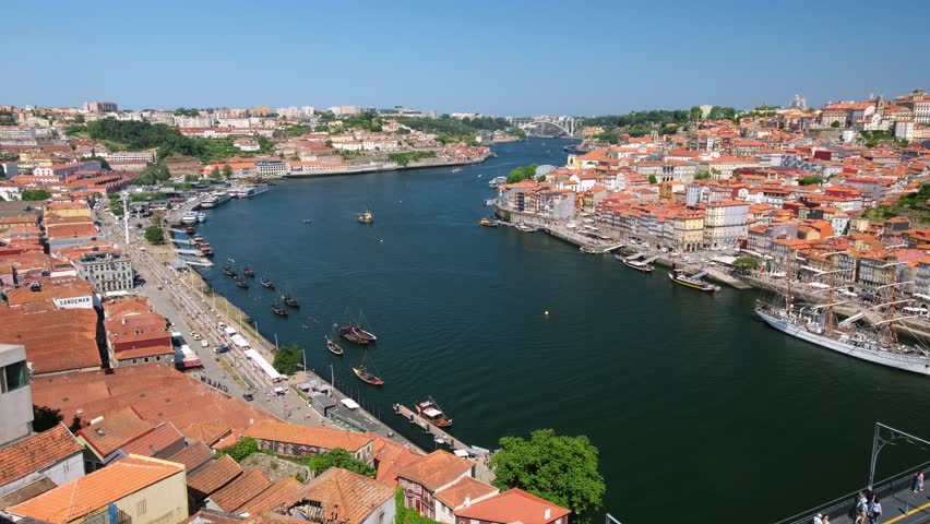 View of Porto city and Douro river and Dom Luis I bridge with metro tram from famous tourist viewpoint Miradouro da Serra do Pilar. Porto, Vila Nova de Gaia, Portugal