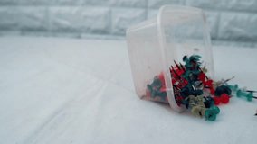 Colorful push pins scattered on a white surface background, ideal for office, school, or craft themes. - Powered by Shutterstock - Get 15% off with code: PIKWIZARD15