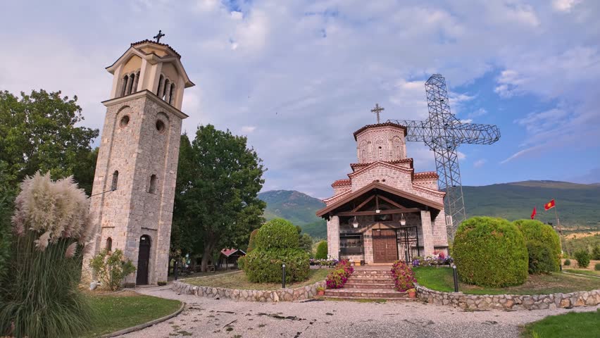 TIME-LAPSE of St. Peter and Paul church in Podmochani, Macedonia, with a dominant cross, blending faith, history, and natural beauty