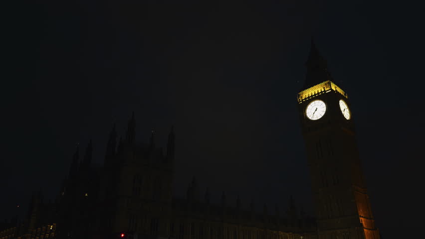 The breathtaking and stunning night view of Big Ben alongside the Houses of Parliament located in London, England