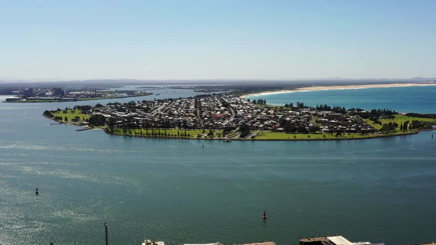 Hunter river Pacific ocean delta in busy industrial port of Newcastle city in AU as 4k.
