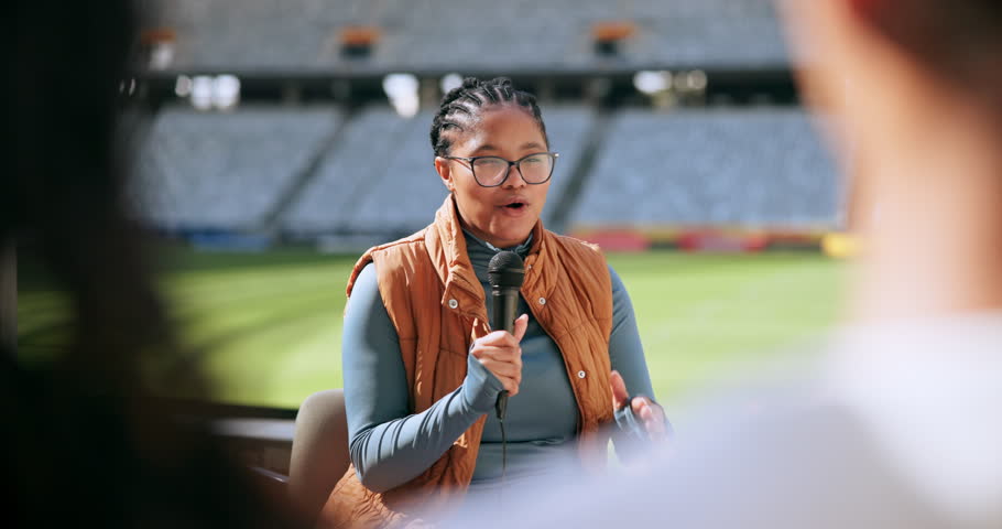 Journalist, microphone and talking in stadium for interview, press conference and sport with broadcast. Woman, question and media relations presentation in arena for fitness event, television or news