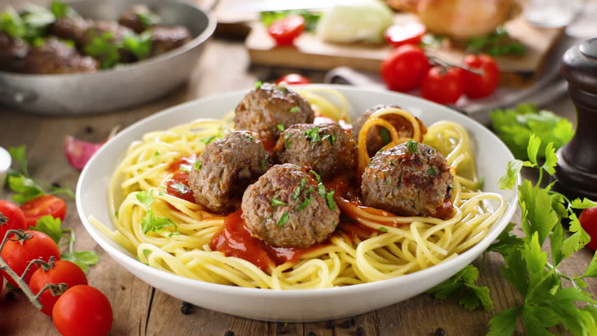 bowl of spaghetti with meatballs and tomato sauce