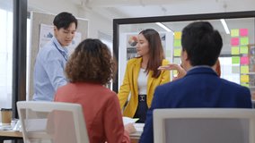 Modern office with an Asian business team sharing creative ideas. Collaborative professionals brainstorming strategies in a sleek, innovative environment, promoting teamwork and diversity - Powered by Shutterstock - Get 15% off with code: PIKWIZARD15