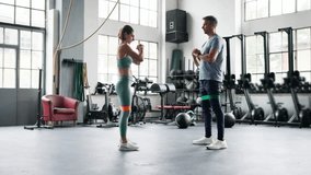 Couple Training Glutes With Stretch Bands In Gym - Powered by Shutterstock - Get 15% off with code: PIKWIZARD15