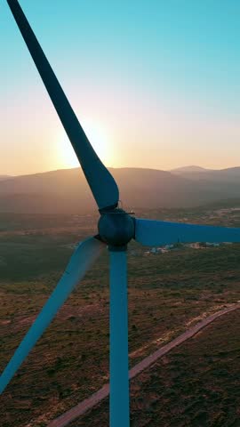 Vertical video of wind power plant - vertical high quality video of wind turbine taken from the air by drone