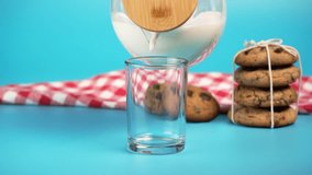 Speed ​​ramp effect a glass jar with a wooden lid fills a glass with milk, chocolate chip cookies - Powered by Shutterstock - Get 15% off with code: PIKWIZARD15