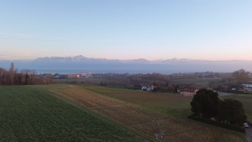 Aerial View of Swiss Countryside with Historic Castle Scenic Landscape. Stunning drone footage of a historic Swiss castle in the scenic countryside near Yverdon, Switzerland. for travel promotions.