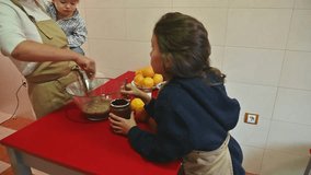 Family baking together in the kitchen with chocolate - Powered by Shutterstock - Get 15% off with code: PIKWIZARD15