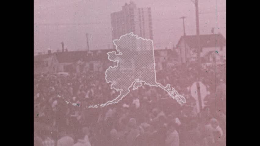 United States CIRCA 1970s: Outline of Alaska. Superimpose Alaska over the Lower 48. Mountain ranges in Alaska. Denali reflected in Wonder Lake. Glacier at the edge of water.