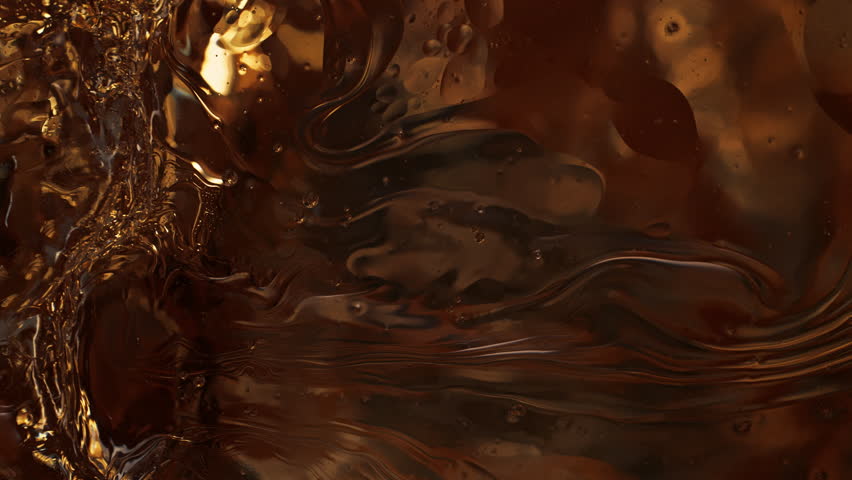Super Slow Motion Shot of Golden Oil Waving in Water at 1000fps.