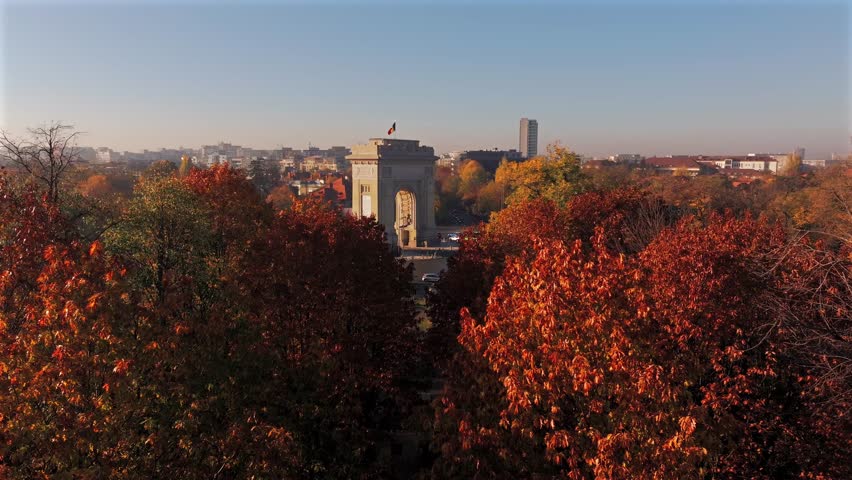 Arch of Triumph 4k video. Beautiful aerial view of this amazing landmark from Bucharest, Romania, during an autumn morning sunrise. Travel to Romania.