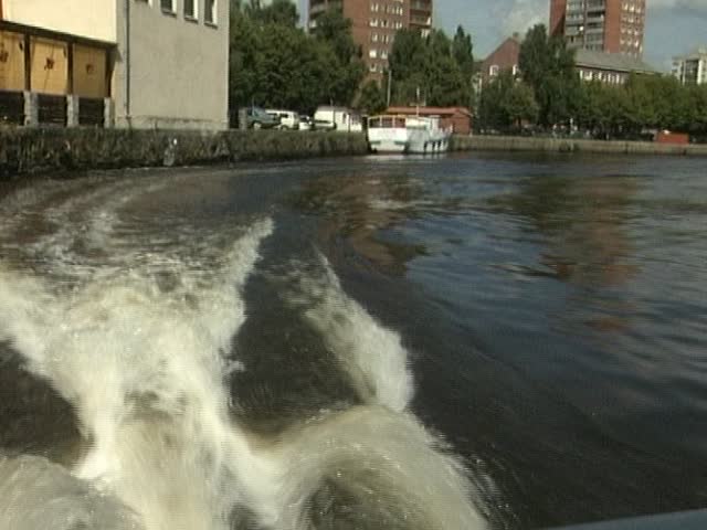 boat trip on the river in the city on sunny summer day