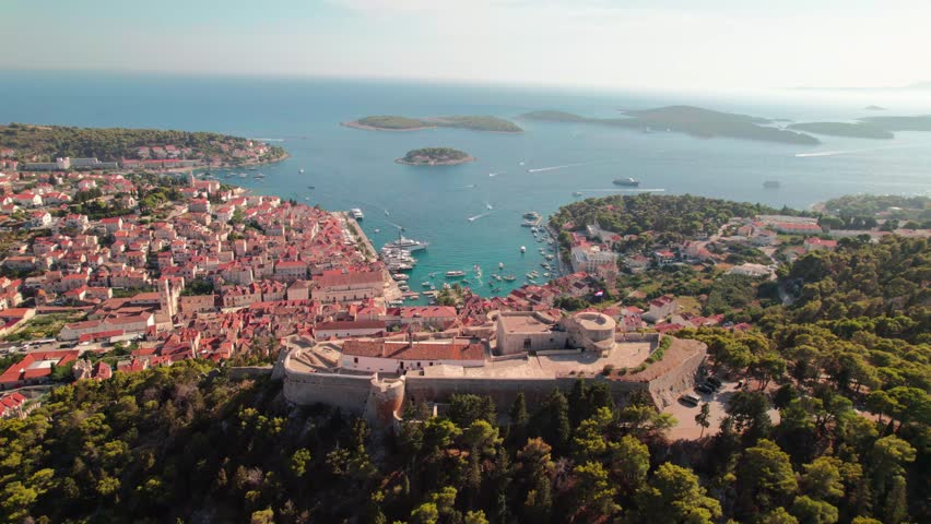 Fortica Fortress And Port Resort Town Of Hvar In Croatian Island. Aerial Drone Shot