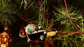 Black blues, rock-n-roll car with Christmas tree, toy decorations. New Year and Merry Christmas. Smooth camera movement on the slider. Video postcard. Live christmas tree with garlands and toys - Powered by Shutterstock - Get 15% off with code: PIKWIZARD15
