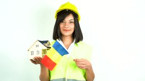  Home inspector woman or engineer holding romania flag and detached house model - Powered by Shutterstock - Get 15% off with code: PIKWIZARD15