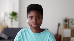 POV or portrait screen view of young adult African woman listening on laptop computer video call at home. Virtual meeting and web conference concept.  - Powered by Shutterstock - Get 15% off with code: PIKWIZARD15