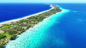 Drone Tuamotus atoll. Aerial view Fakarava island in French Polynesia. Tropical beach, palm trees and clear ocean water. Exotic travel destination for honeymoon, cruise and scuba diving.  - Powered by Shutterstock - Get 15% off with code: PIKWIZARD15