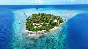 Drone Rangiroa atoll. Aerial view Tuamotu islands in French Polynesia. Tropical beach, palm trees and clear ocean water. Exotic travel destination for honeymoon, cruise, snorkeling and scuba diving.  - Powered by Shutterstock - Get 15% off with code: PIKWIZARD15