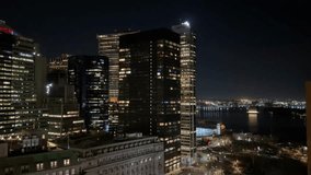 The breathtaking skyline of a bustling city at night showcases radiant buildings adorned with vibrant lights in New York Manhattan. - Powered by Shutterstock - Get 15% off with code: PIKWIZARD15