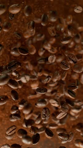 Super Slow Motion of Whole Roasted Coffee Beans Exploding , Filmed on High Speed Cinematic Camera at 1000 FPS