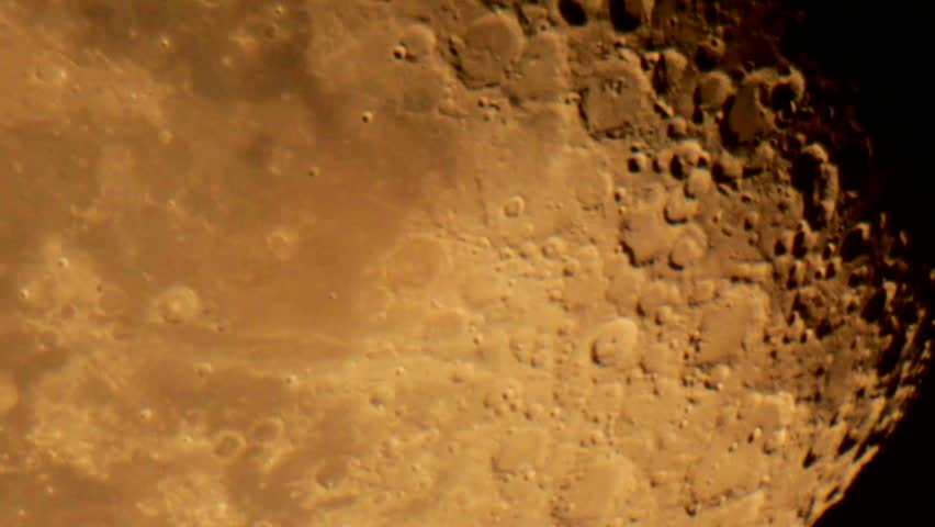 Telescopic view of a rising moon in conjunction with an airplane crossing the lunar southpole