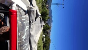 man is driving through the mountains in jeeps, extreme sport.Tourists extremals traveling offroad in the mountains by jeep, adventure concept. Vertical video - Powered by Shutterstock - Get 15% off with code: PIKWIZARD15