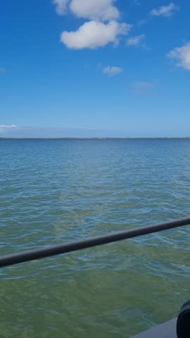 Ferry Boat Araruama Praia Seca (Dry Beach) - Crossing Araruama Lagoon, Brazil, with natural beauty over calm salt waters in a sunny day.  Vacation  at Região dos Lagos.