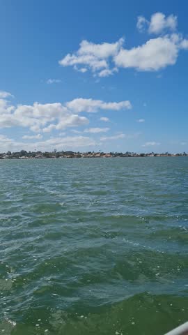 Ferry Boat Araruama Praia Seca (Dry Beach) - Crossing Araruama Lagoon, Brazil, with natural beauty over calm salt waters in a sunny day.  Vacation  at Região dos Lagos.