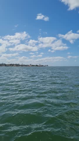 Ferry Boat Araruama Praia Seca (Dry Beach) - Crossing Araruama Lagoon, Brazil, with natural beauty over calm salt waters in a sunny day.  Vacation  at Região dos Lagos.