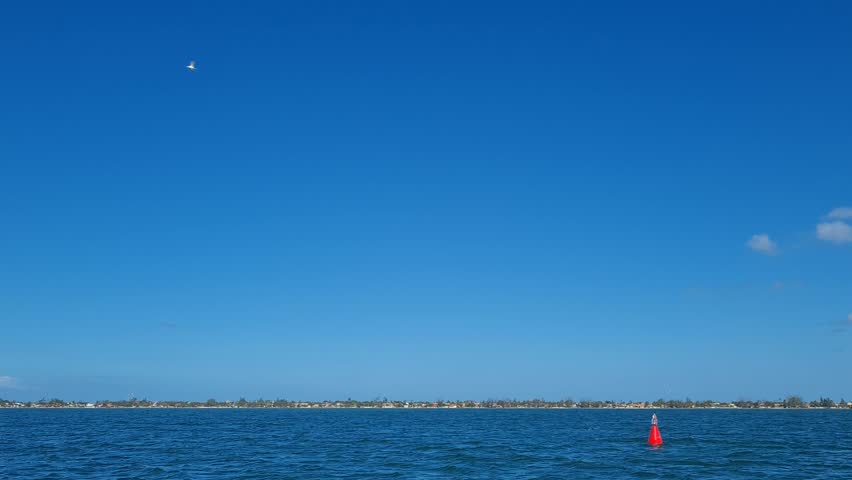 Ferry Boat Araruama Praia Seca (Dry Beach) - Crossing Araruama Lagoon, Brazil, with natural beauty over calm salt waters in a sunny day.  Vacation  at Região dos Lagos.