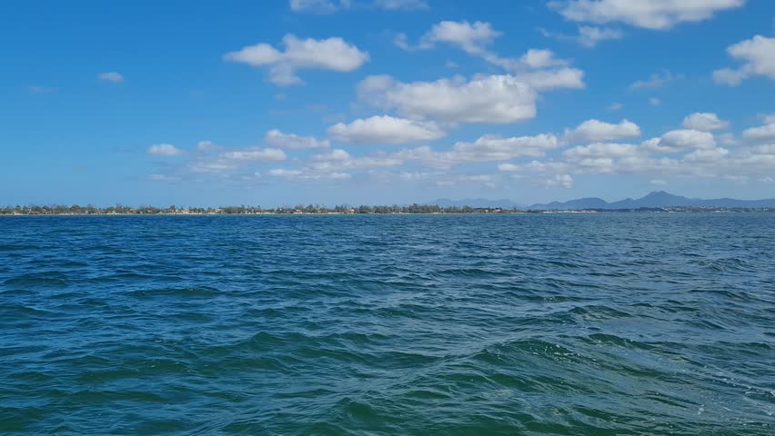 Ferry Boat Araruama Praia Seca (Dry Beach) - Crossing Araruama Lagoon, Brazil, with natural beauty over calm salt waters in a sunny day.  Vacation  at Região dos Lagos.