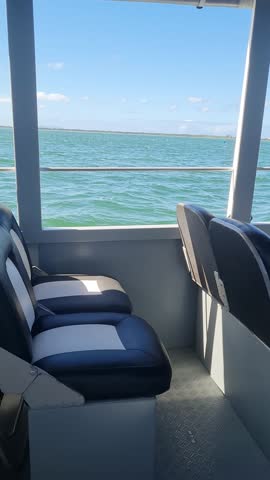 Ferry Boat Araruama Praia Seca (Dry Beach) - Crossing Araruama Lagoon, Brazil, with natural beauty over calm salt waters in a sunny day.  Vacation  at Região dos Lagos.