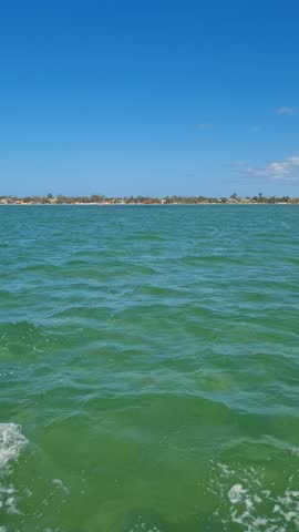 Ferry Boat Araruama Praia Seca (Dry Beach) - Crossing Araruama Lagoon, Brazil, with natural beauty over calm salt waters in a sunny day.  Vacation  at Região dos Lagos.