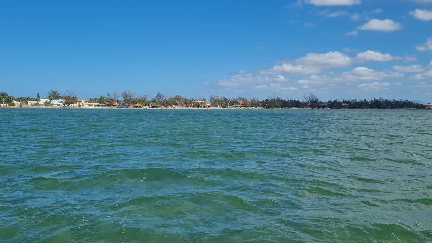 Ferry Boat Araruama Praia Seca (Dry Beach) - Crossing Araruama Lagoon, Brazil, with natural beauty over calm salt waters in a sunny day.  Vacation  at Região dos Lagos.