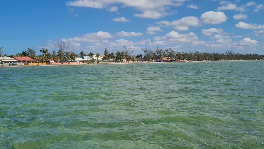 Ferry Boat Araruama Praia Seca (Dry Beach) - Crossing Araruama Lagoon, Brazil, with natural beauty over calm salt waters in a sunny day.  Vacation  at Região dos Lagos.