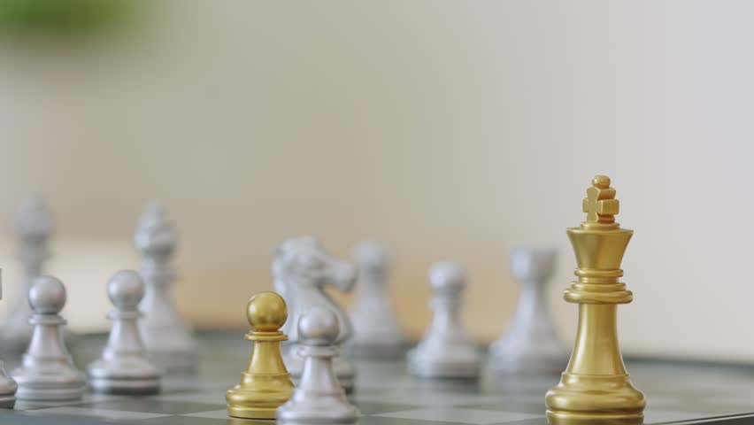Close up hands playing chess game during competition in chess club. A confident players hands moving chess pieces while participate in board game match on a table in chess school club community center