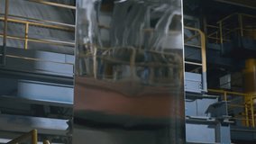 A sheet of galvanized metal moves along a conveyor. - Powered by Shutterstock - Get 15% off with code: PIKWIZARD15
