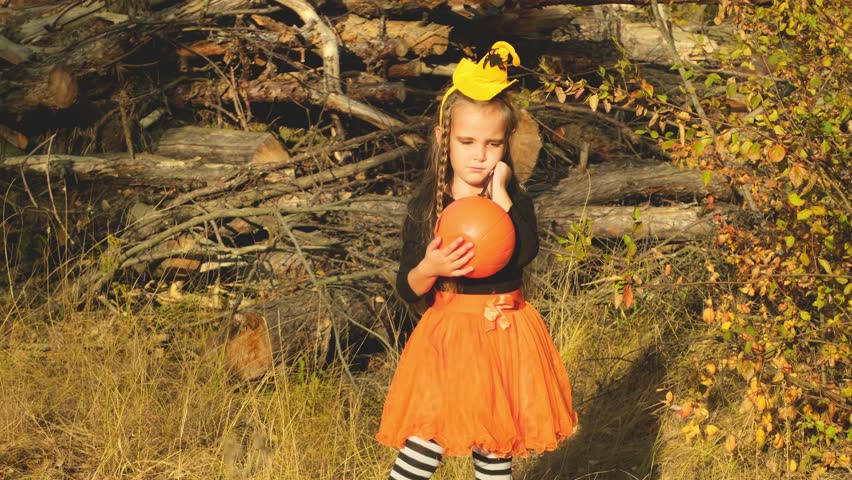 Portrait of smiling girl trick or treating in halloween costume. Childhood, tradition and halloween concept.