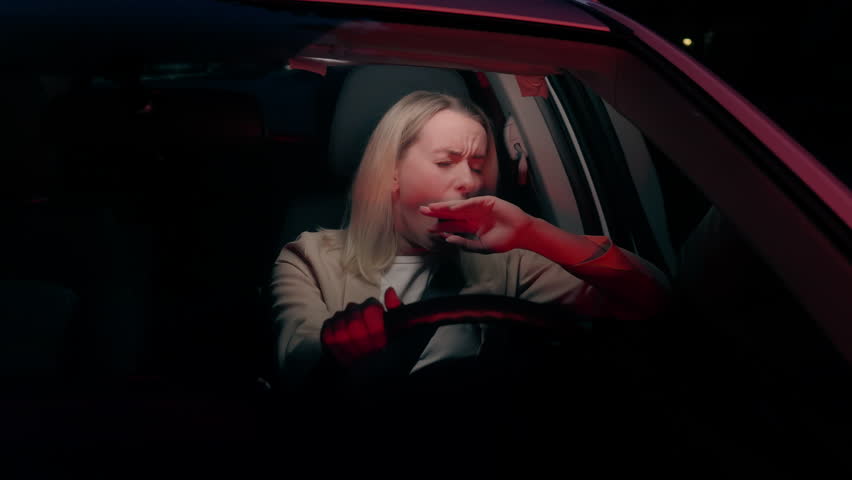 Sleepy exhausted Caucasian woman car driver female girl inside automobile yawning asleep fatigue sleeping in automobile traffic sleep deprivation dangerous insurance driving auto vehicle at late night