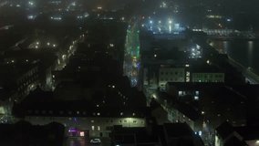 Aerial timelapse of Galway city centre on a foggy night, capturing the Halloween parade - Powered by Shutterstock - Get 15% off with code: PIKWIZARD15