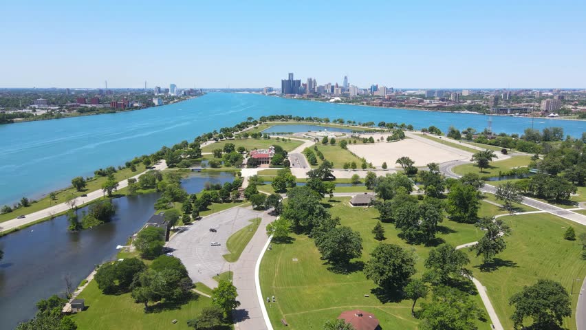 Belle Isle park on Detroit River on sunny summer day with city skyline in background Michigan, USA