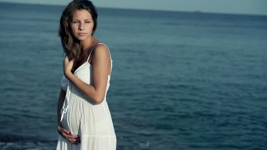 Pregnant woman standing on the seashore, slow motion shot at 120fps
 Royalty-Free Stock Footage #3646739
