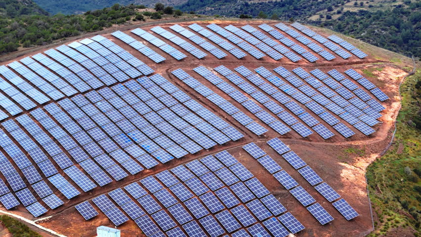 Aerial view of solar panels on hillside, Energy transition technology clean energy concept